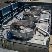 Industrial HVAC facility with chillers, pumps and associated plumbing.